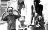These were local kids in Conakry Guinea, West Africa.  I was at a drum makers shop,